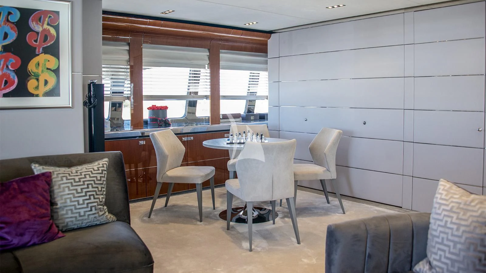 a living room with a couch and a table aboard BLISS Yacht for Sale