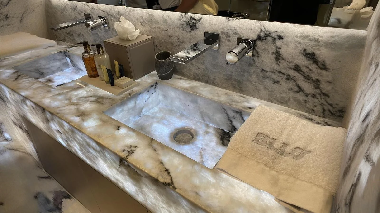 a large marble counter with a few bottles of alcohol on it aboard BLISS Yacht for Sale