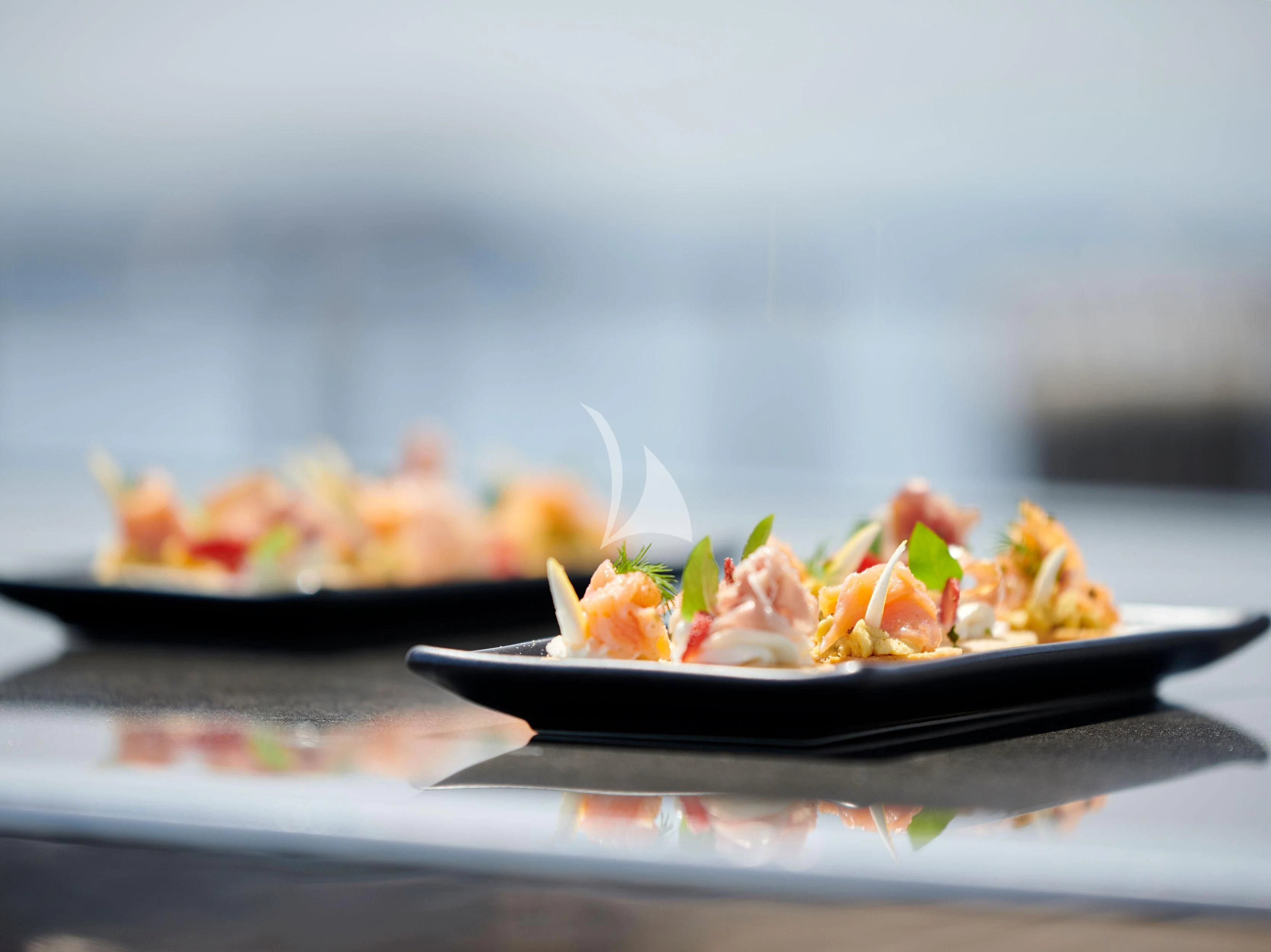 a plate of food aboard BLISS Yacht for Sale