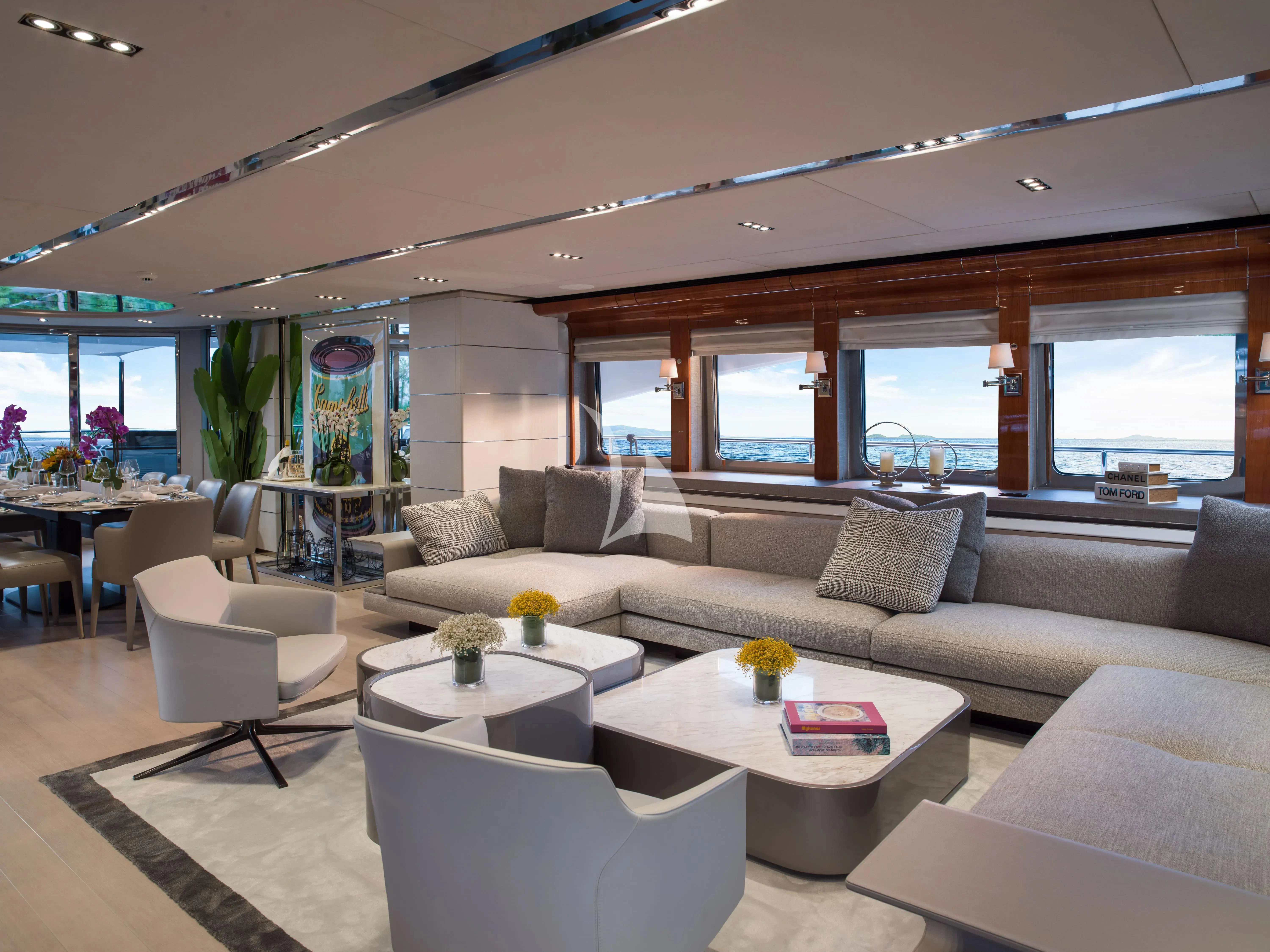 a living room with a couch and a table aboard BLISS Yacht for Sale