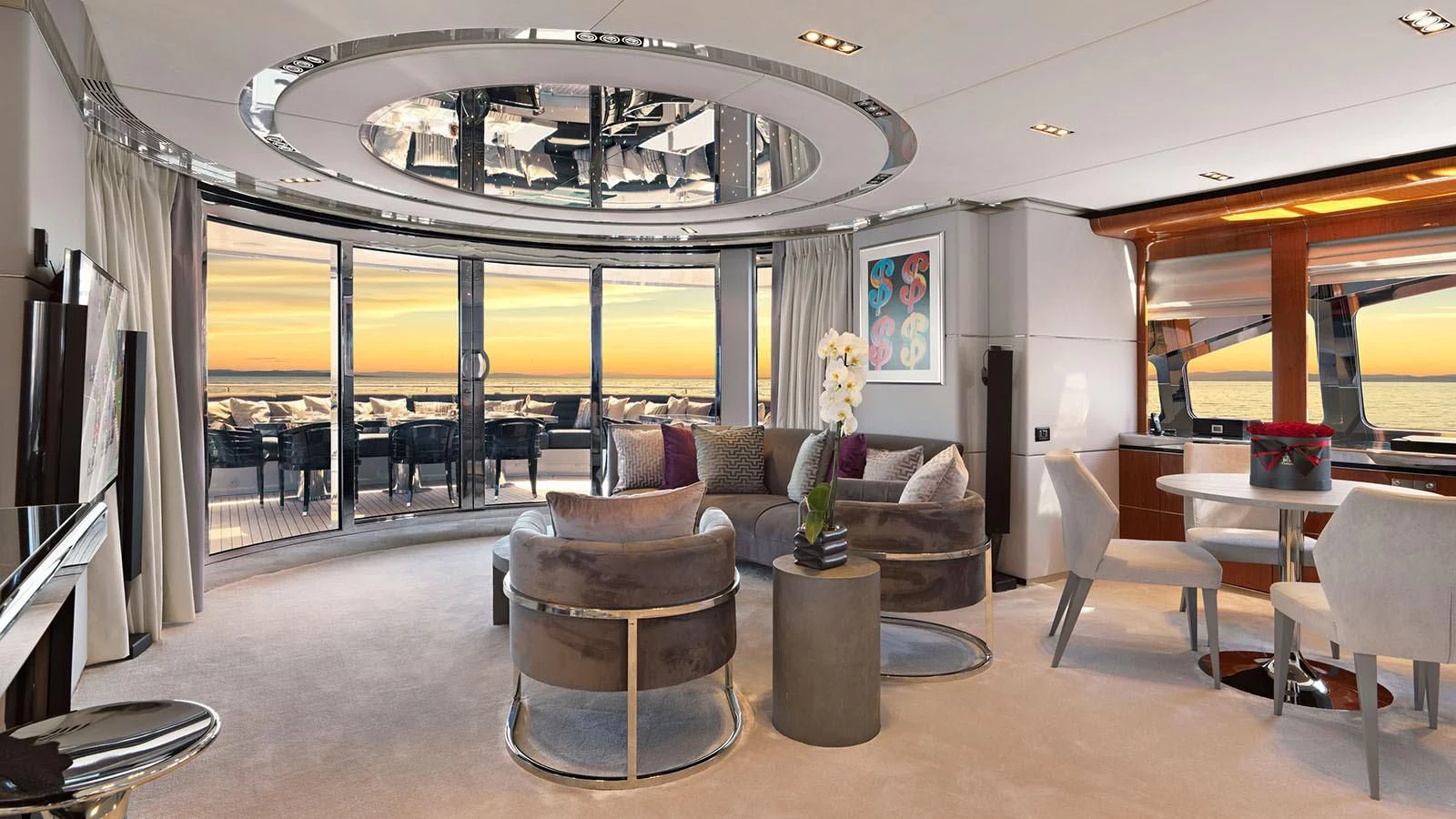a living room with a large chandelier aboard BLISS Yacht for Sale