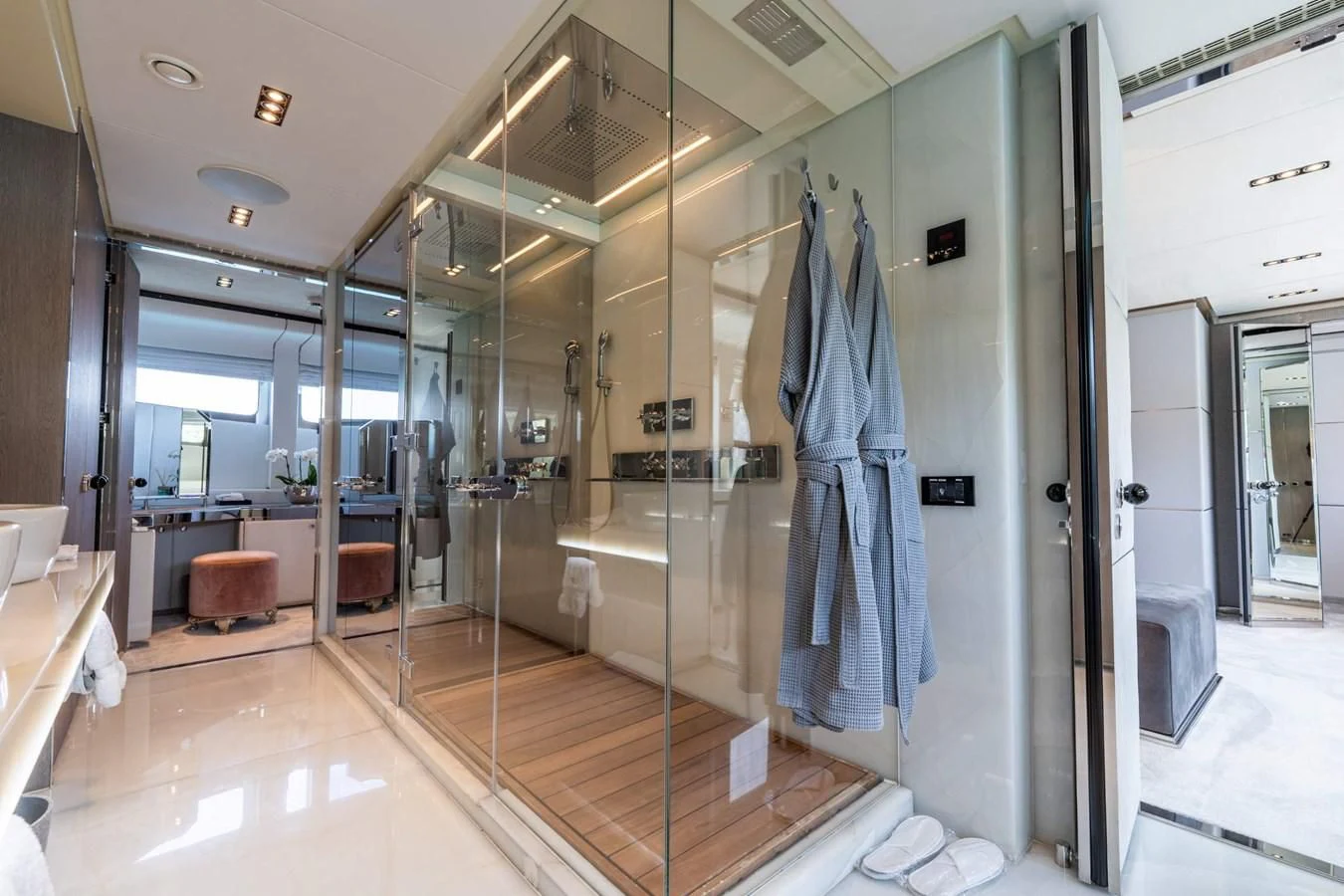 a bathroom with glass walls aboard BLISS Yacht for Sale