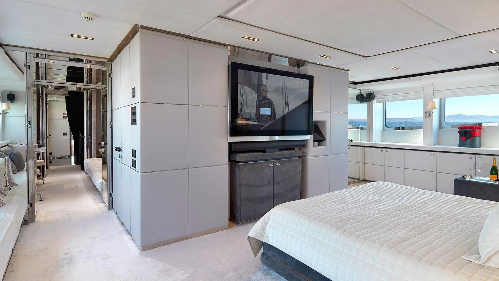 a room with a bed and tv aboard BLISS Yacht for Sale