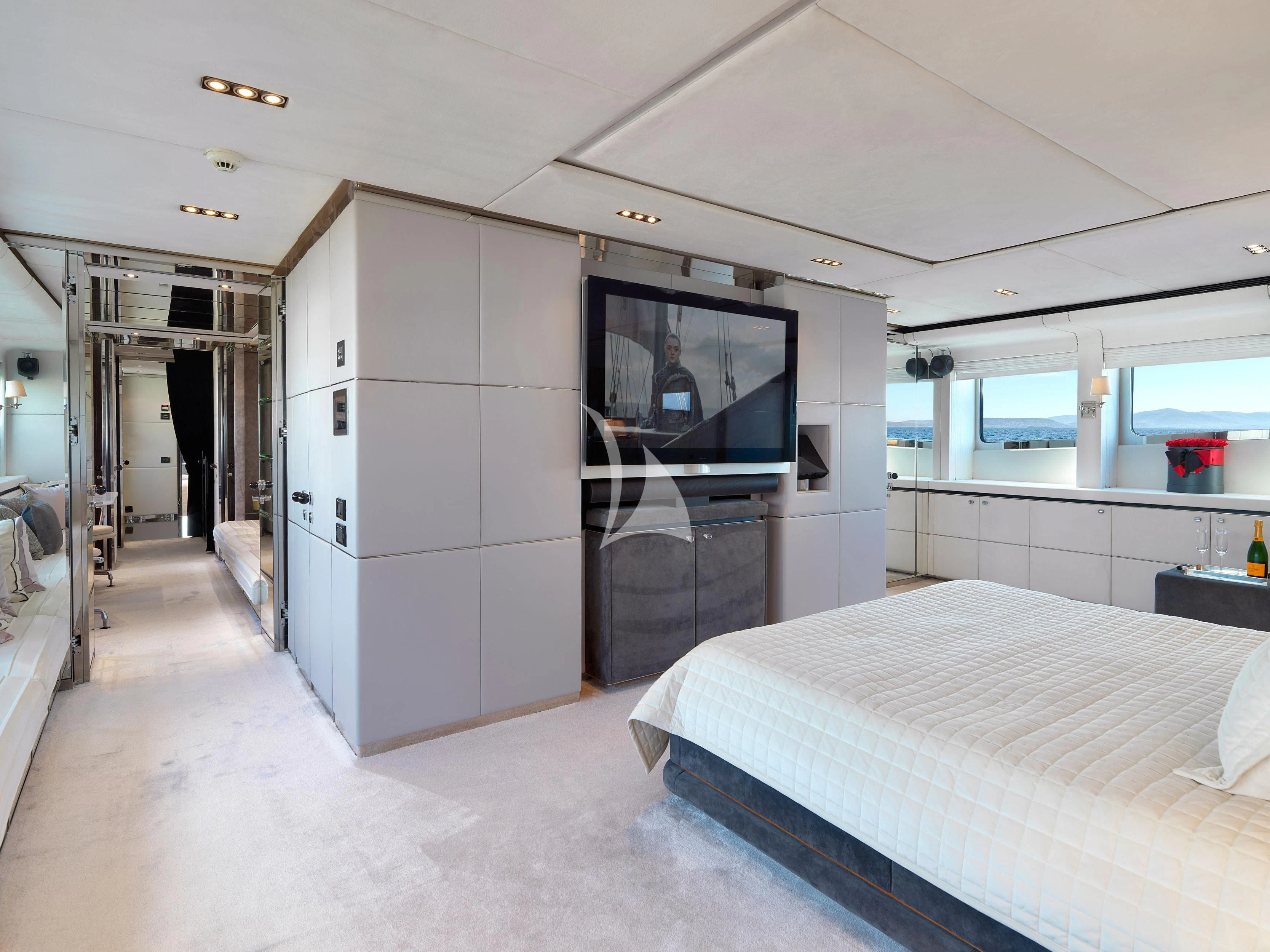 a room with a bed and a television aboard BLISS Yacht for Sale