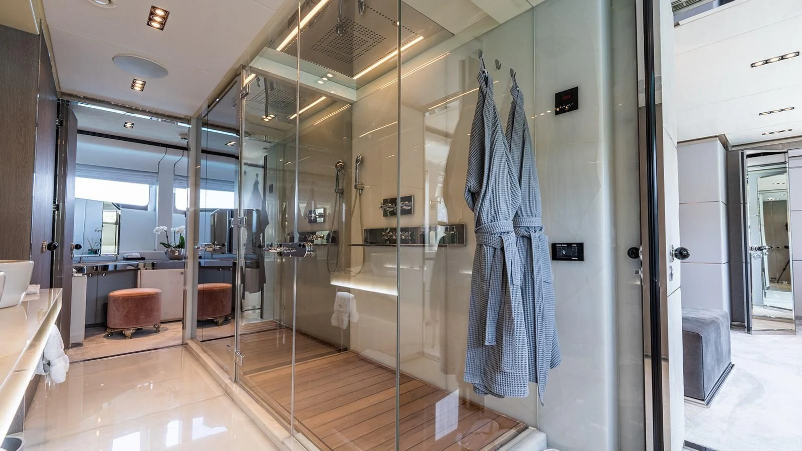 a large bathroom with glass walls aboard BLISS Yacht for Sale