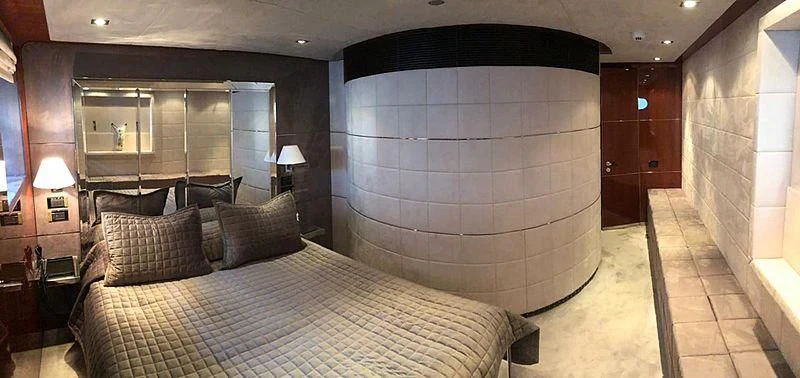 a large bedroom with a large bed aboard BLISS Yacht for Sale