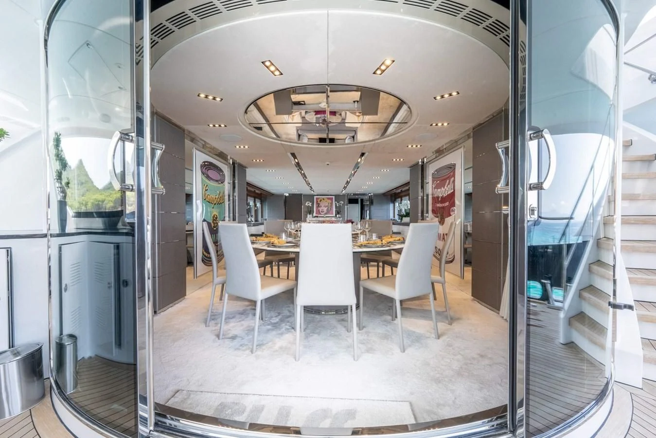 a room with a table and chairs aboard BLISS Yacht for Sale