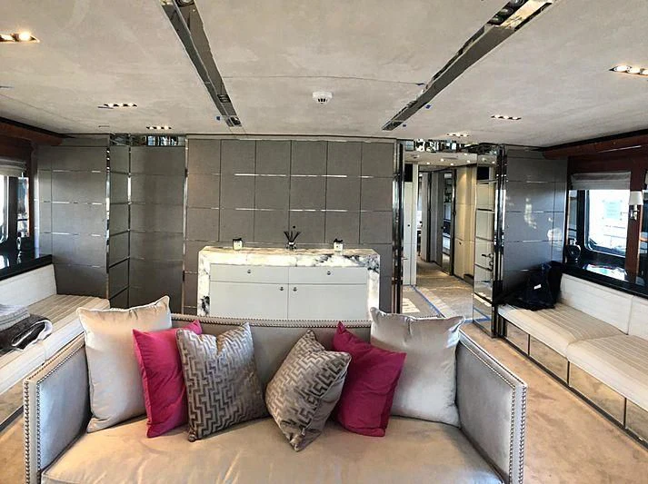 a living room with a large glass wall aboard BLISS Yacht for Sale