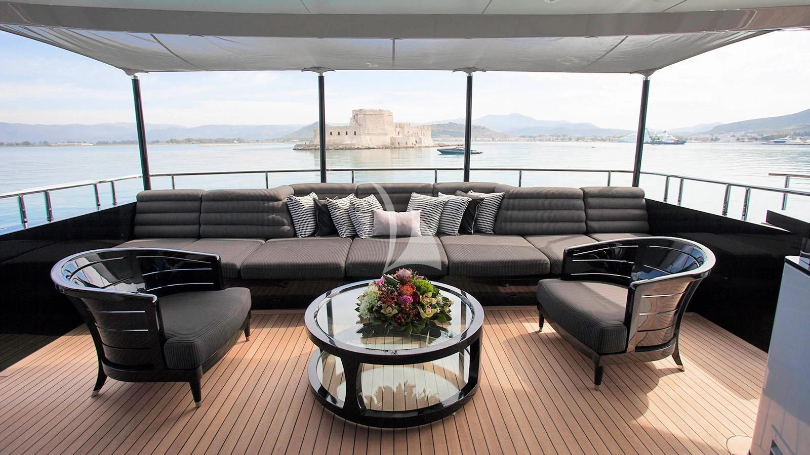 a living room with a couch and a table aboard BLISS Yacht for Sale