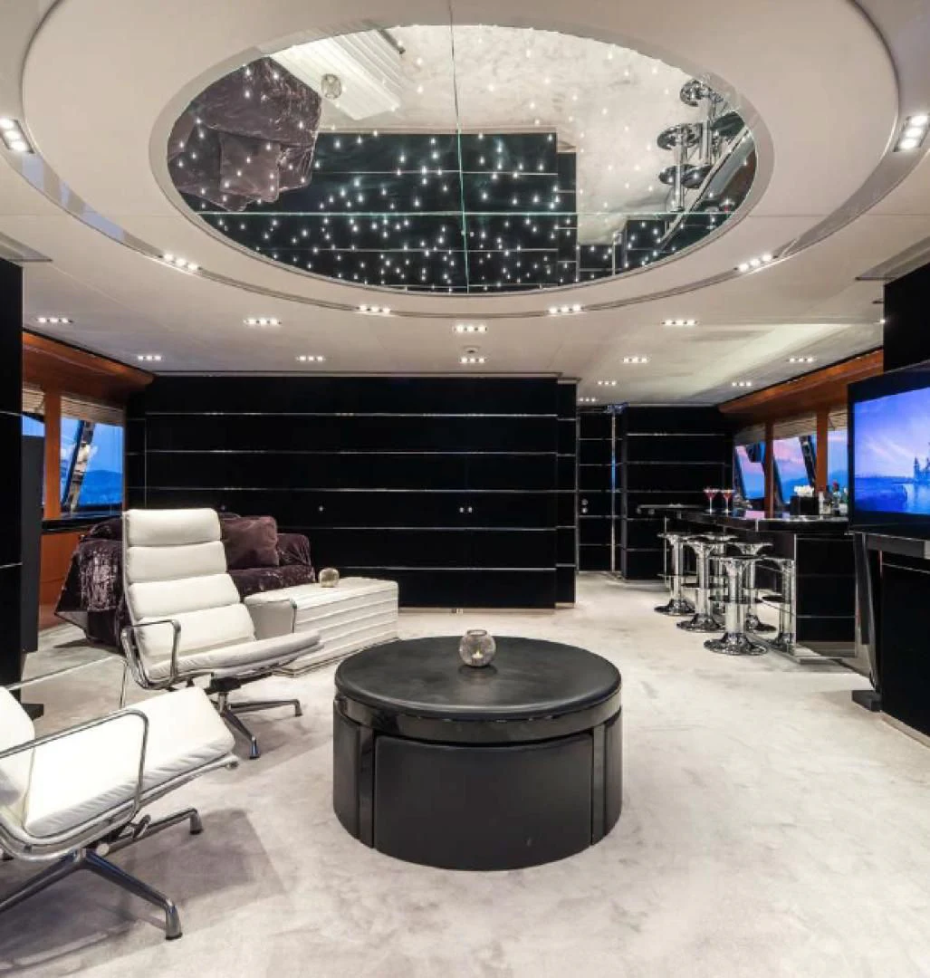 a room with a large chandelier aboard BLISS Yacht for Sale