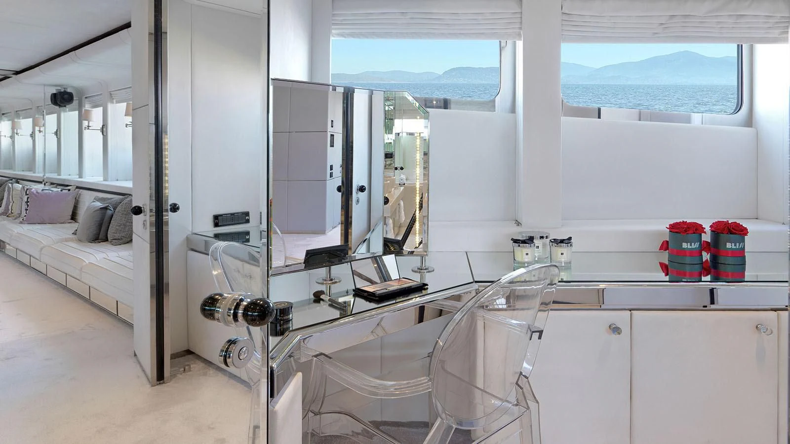 a room with a bed and a mirror aboard BLISS Yacht for Sale