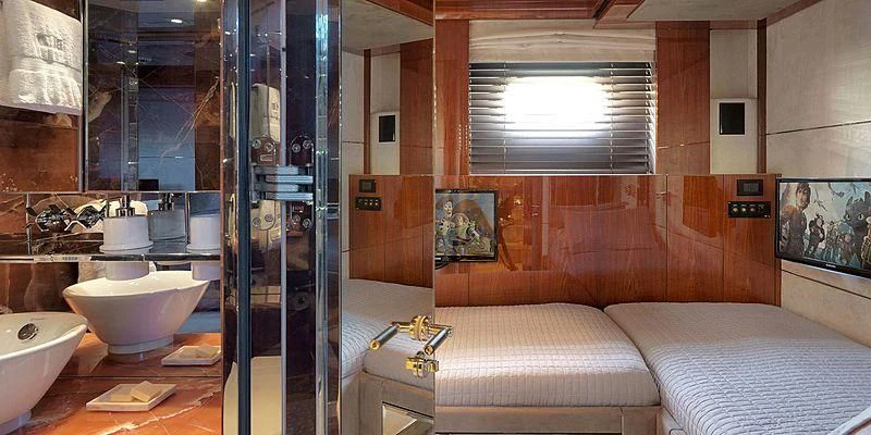 a bathroom with a glass shower aboard BLISS Yacht for Sale