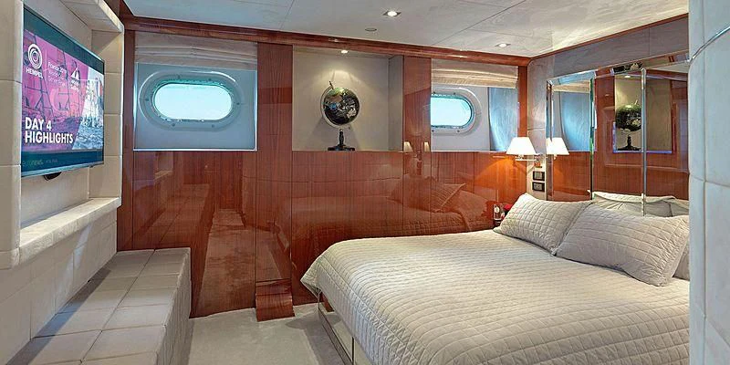 a room with a bed and a mirror aboard BLISS Yacht for Sale