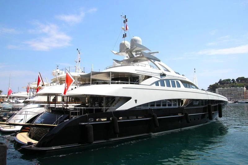 a large boat on the water aboard BLISS Yacht for Sale