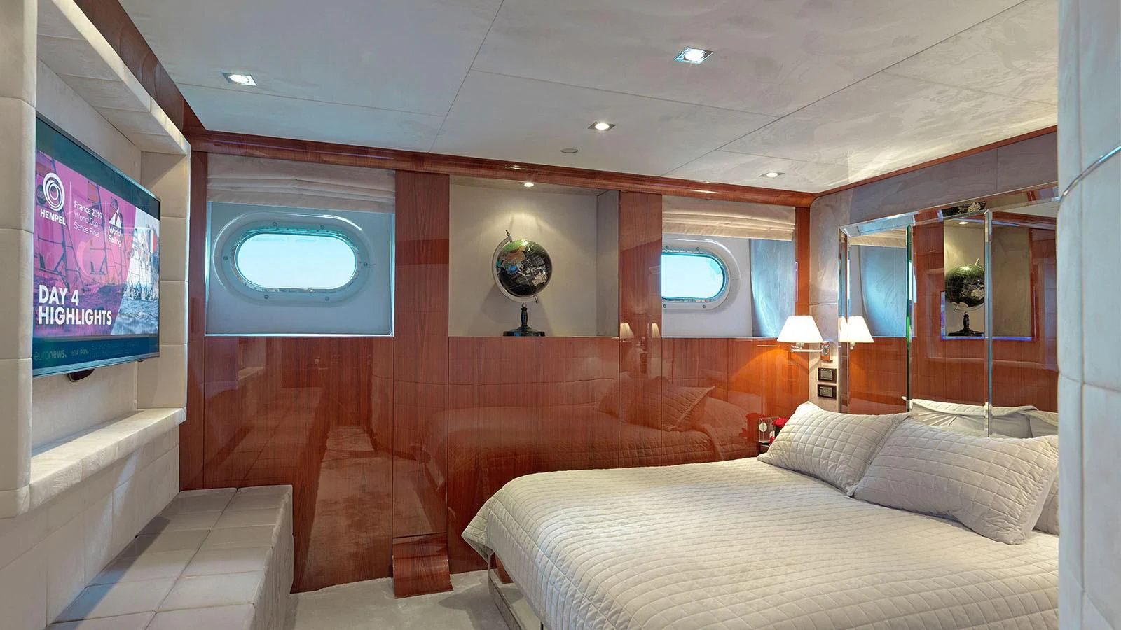 a room with a bed and a television aboard BLISS Yacht for Sale