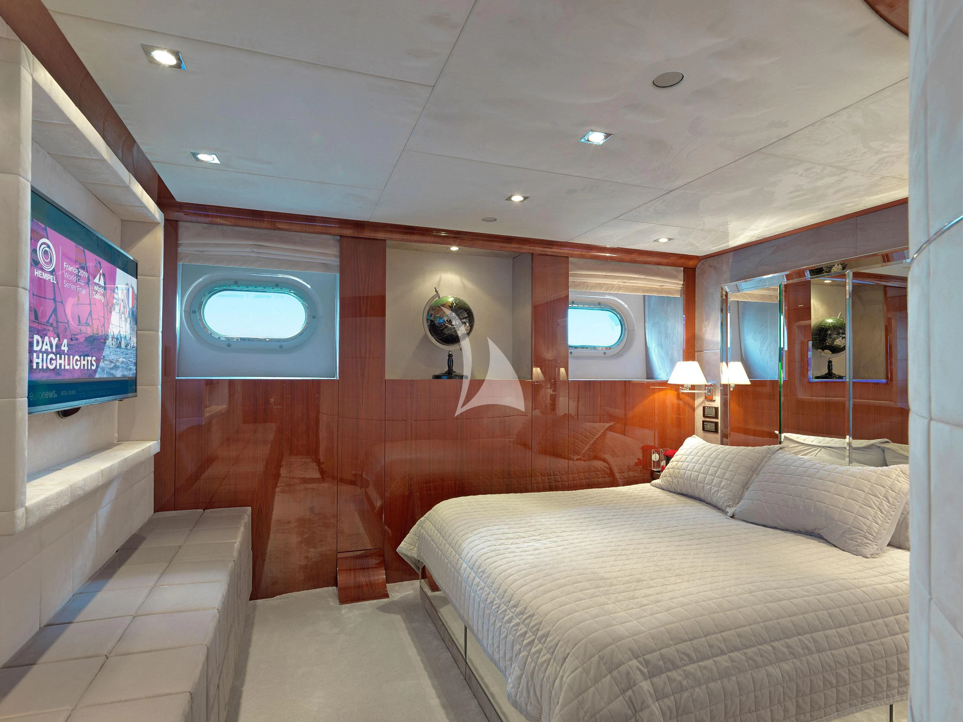 a room with a bed and a television aboard BLISS Yacht for Sale