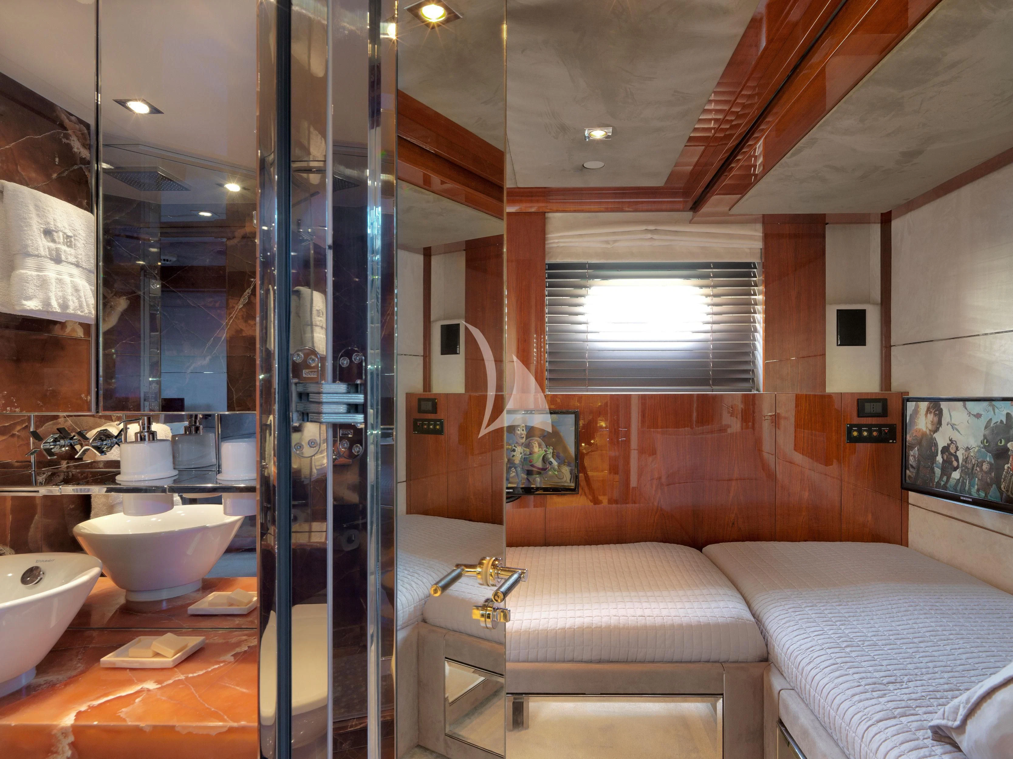 a bathroom with a glass shower aboard BLISS Yacht for Sale