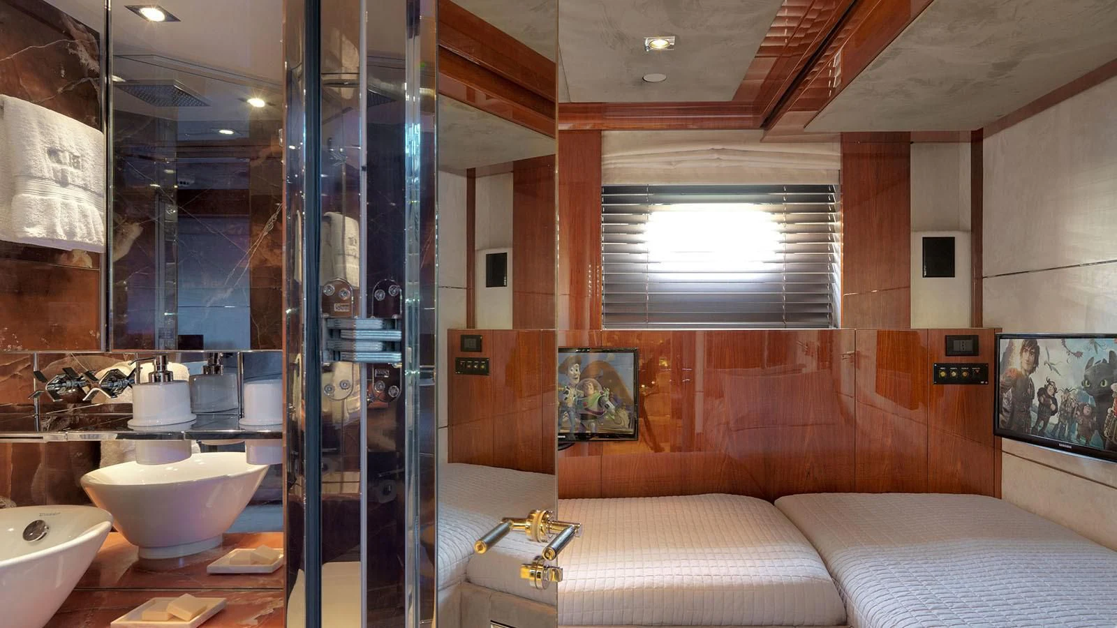a bathroom with a glass shower aboard BLISS Yacht for Sale