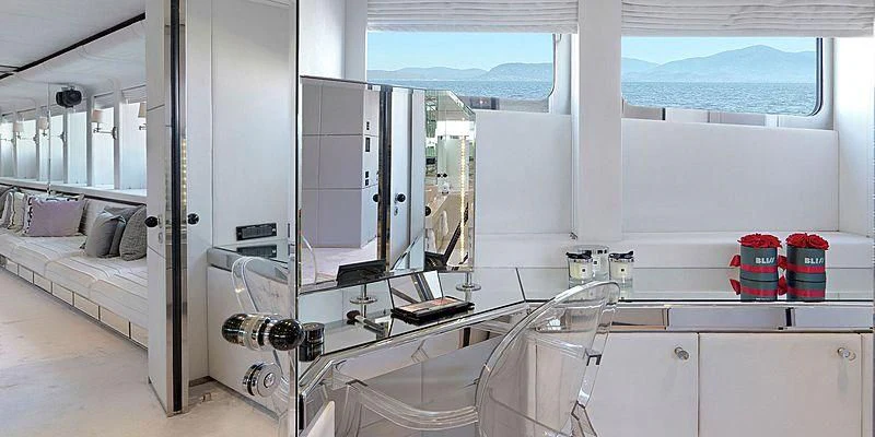 a room with a bed and a mirror aboard BLISS Yacht for Sale
