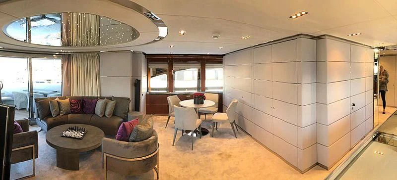 a living room with a couch and a table aboard BLISS Yacht for Sale
