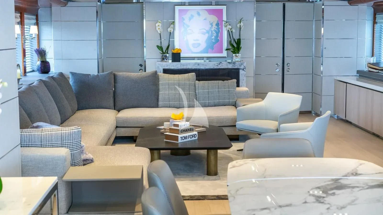 a living room with a couch and a coffee table aboard BLISS Yacht for Sale