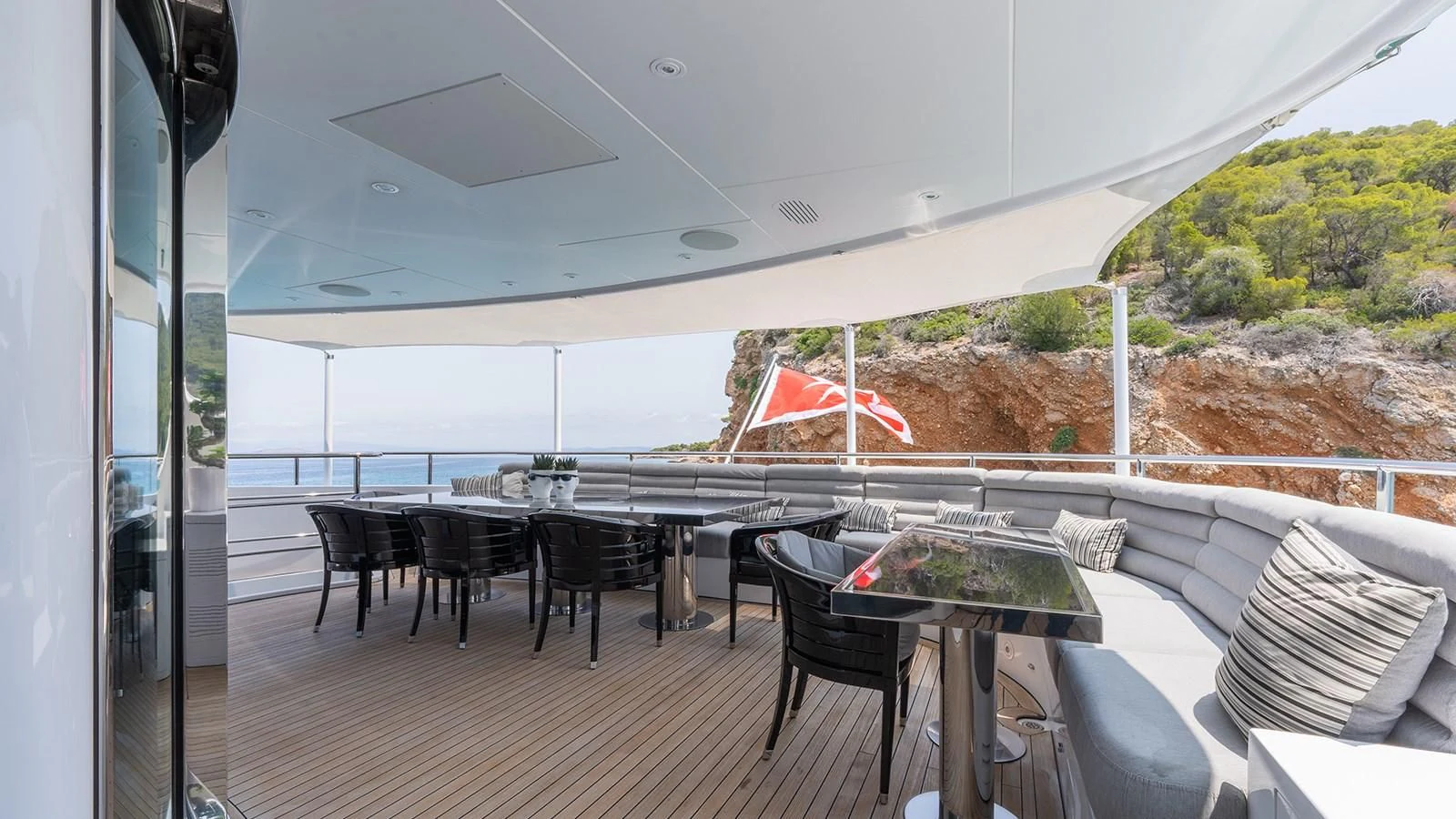 a room with a table and chairs aboard BLISS Yacht for Sale
