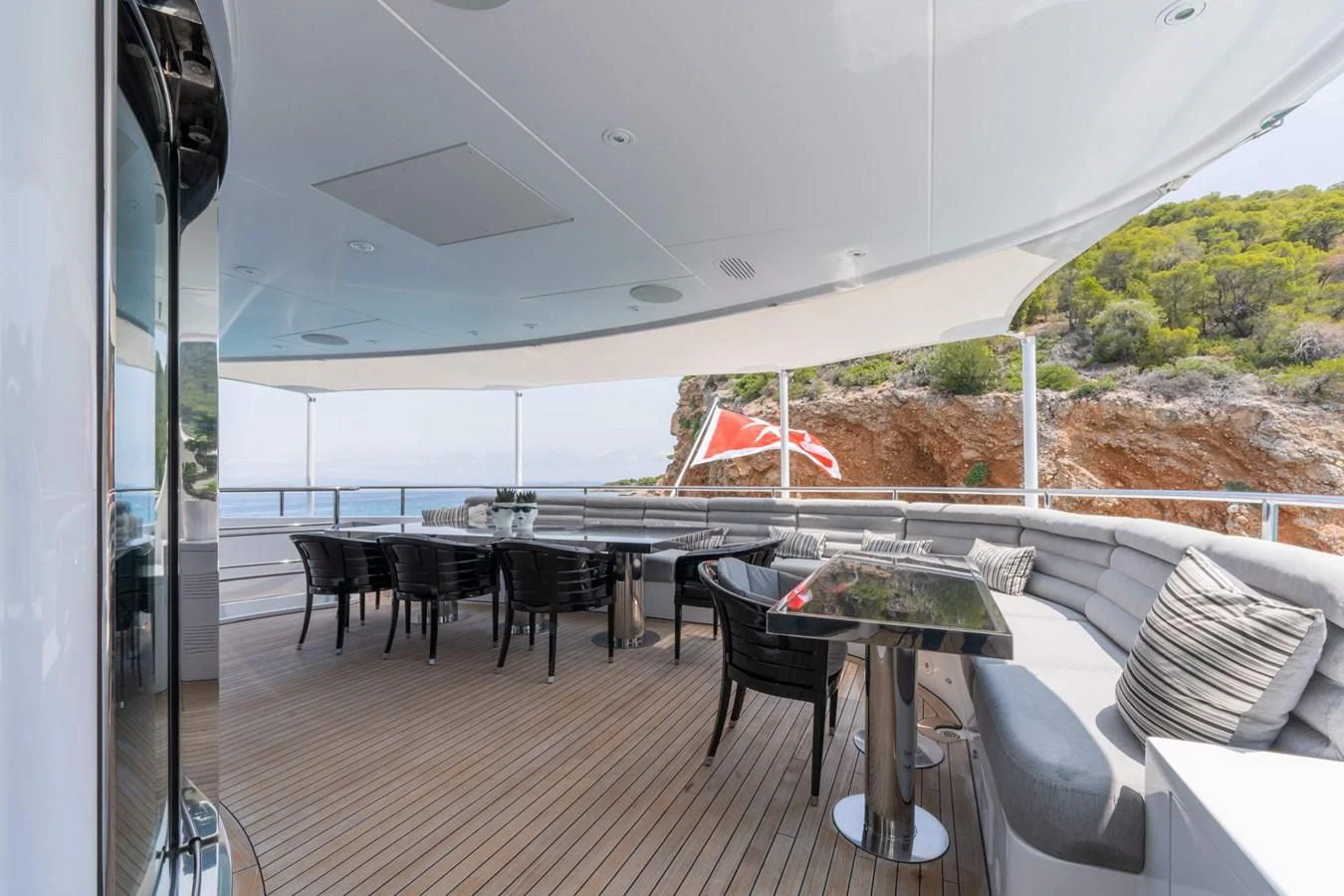 a room with a table and chairs aboard BLISS Yacht for Sale