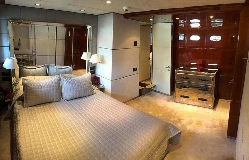 a large bedroom with a bed aboard BLISS Yacht for Sale