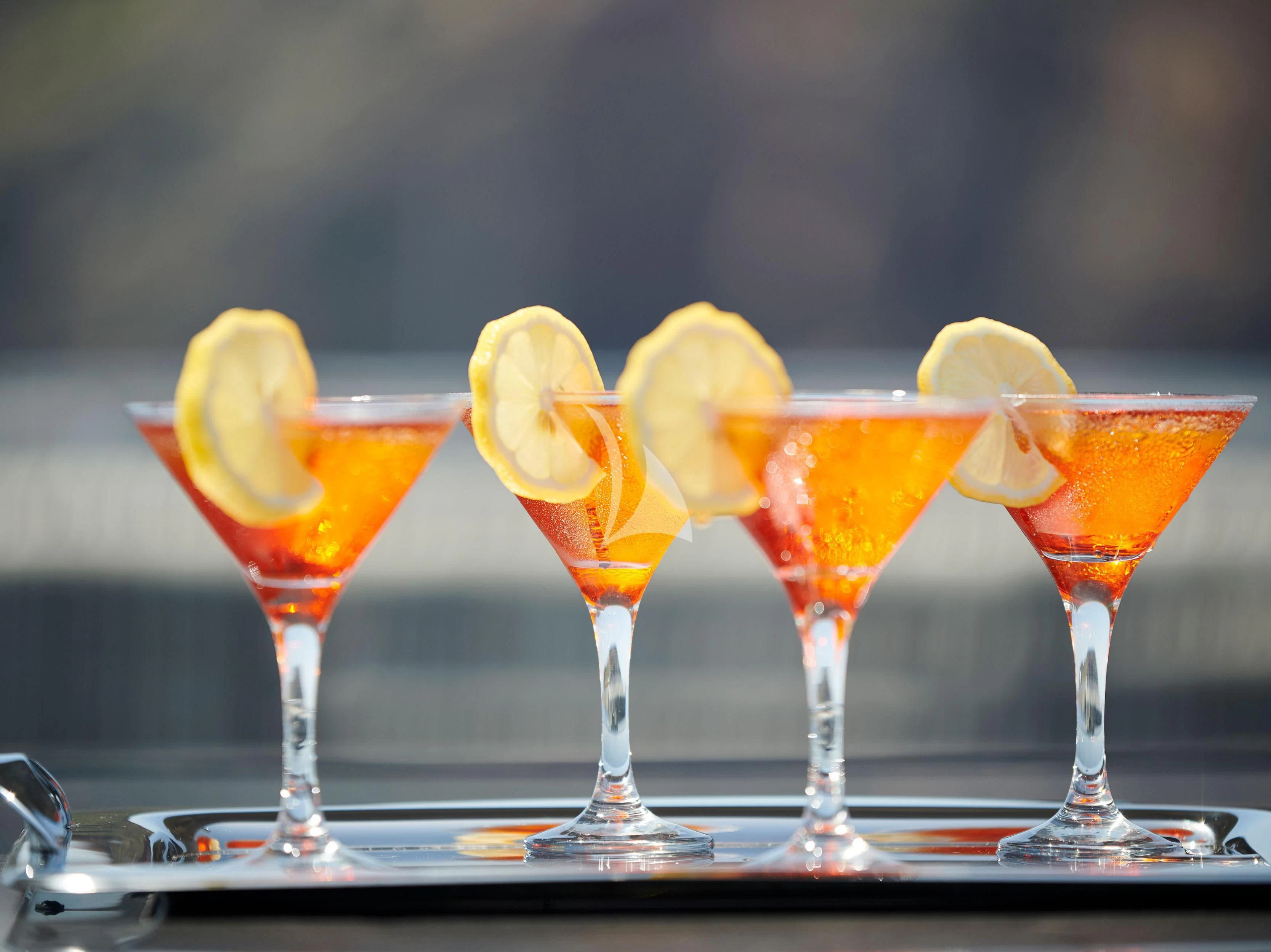 a row of glasses with different colored liquid in them aboard BLISS Yacht for Sale