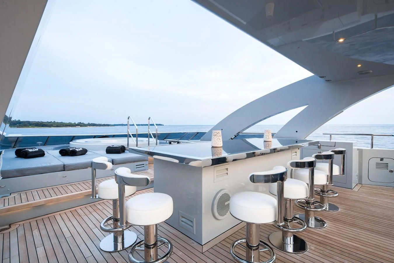 a room with stools and tables aboard BLISS Yacht for Sale