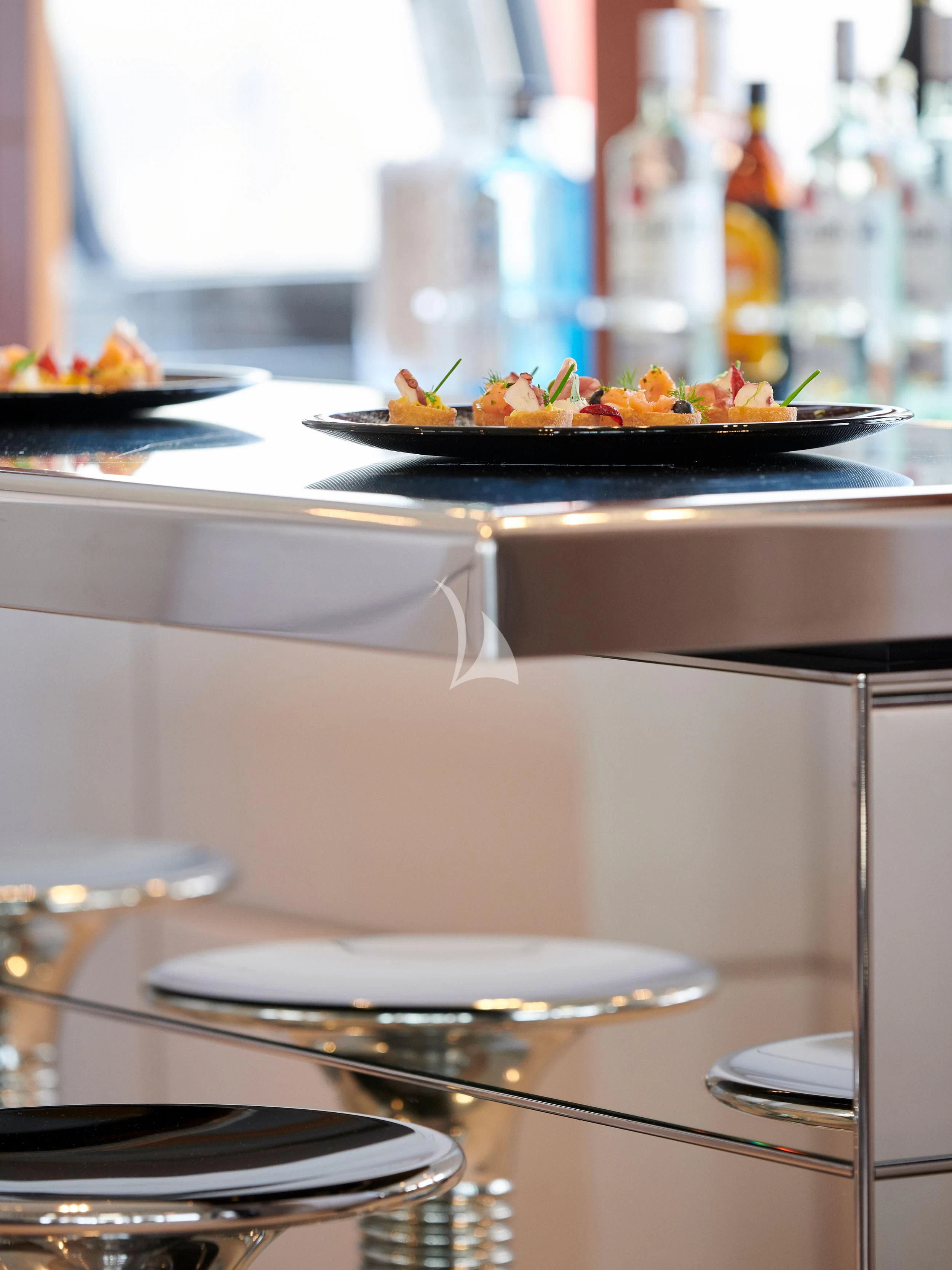 a plate of food on a table aboard BLISS Yacht for Sale