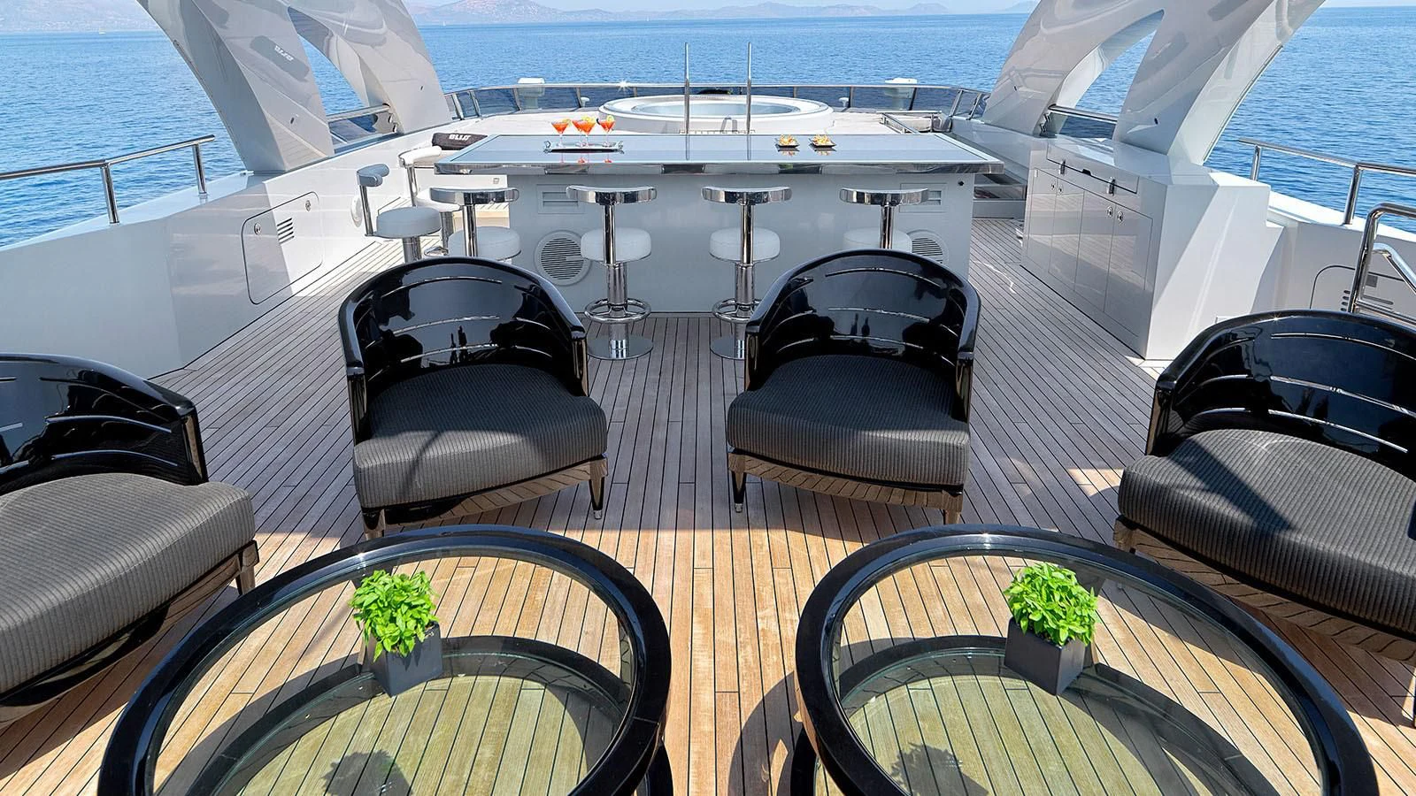 a deck with a large deck and a pool aboard BLISS Yacht for Sale