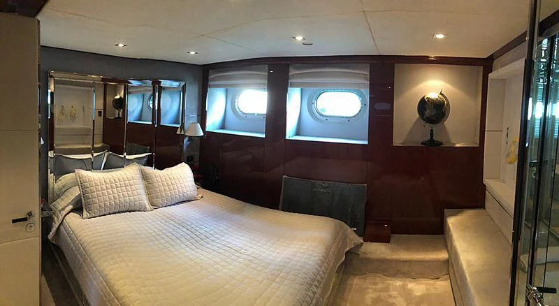 a bed in a room aboard BLISS Yacht for Sale