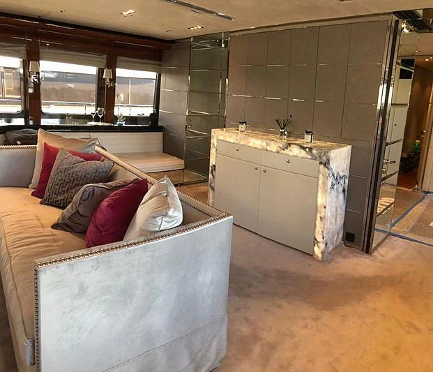 a room with a couch and a sink aboard BLISS Yacht for Sale