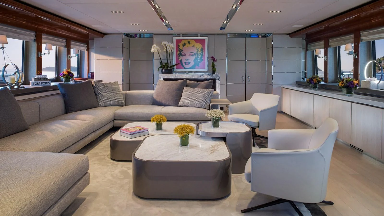 a living room with a couch and a coffee table aboard BLISS Yacht for Sale