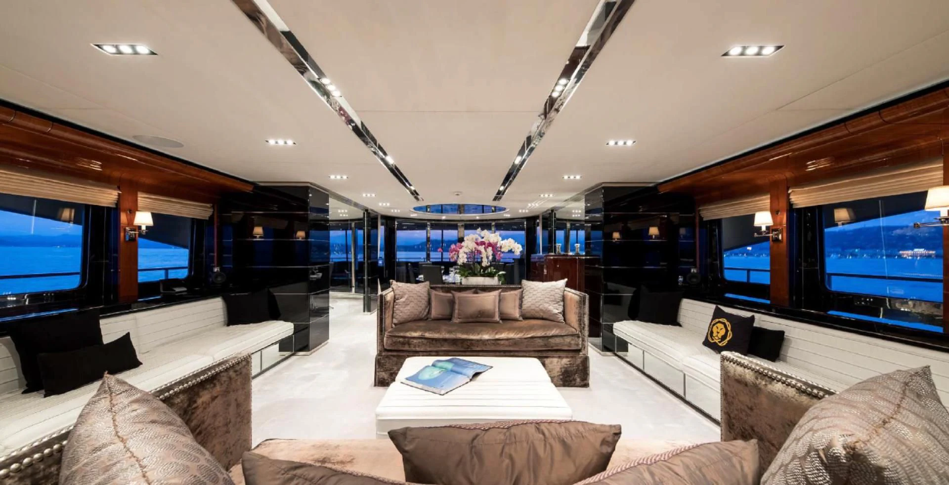 a living room with a large screen aboard BLISS Yacht for Sale
