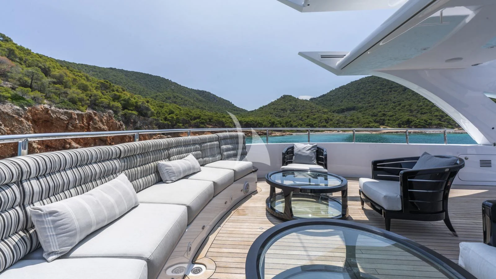 a patio with a table and chairs aboard BLISS Yacht for Sale