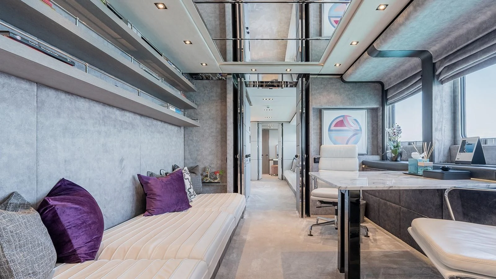 a room with a bed and a desk aboard BLISS Yacht for Sale