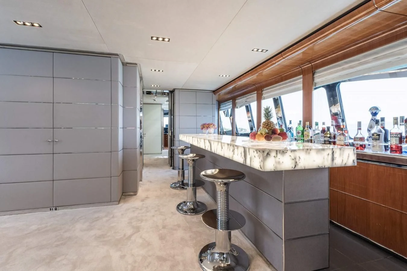 a kitchen with white cabinets aboard BLISS Yacht for Sale