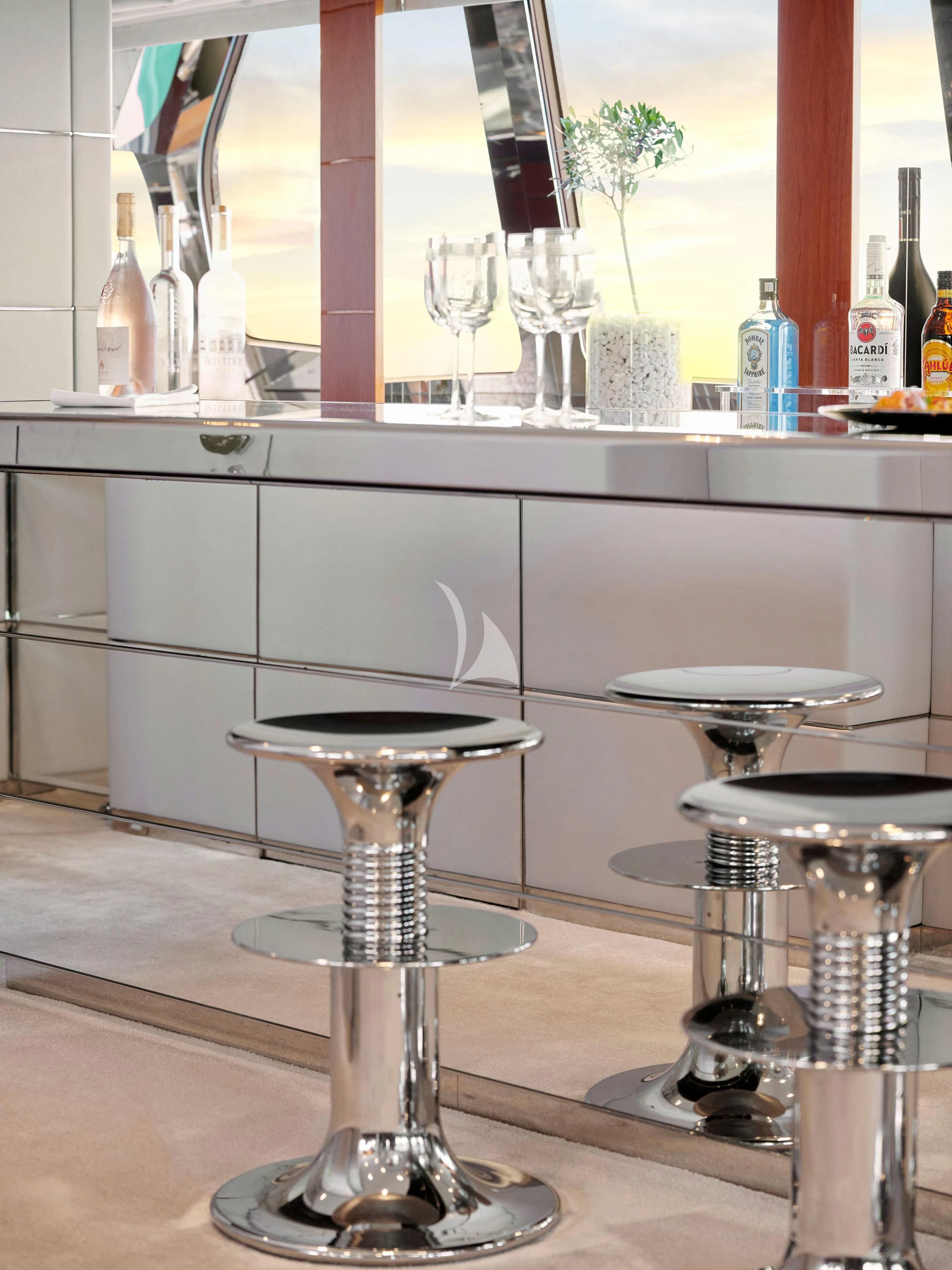 a bar counter with glasses aboard BLISS Yacht for Sale