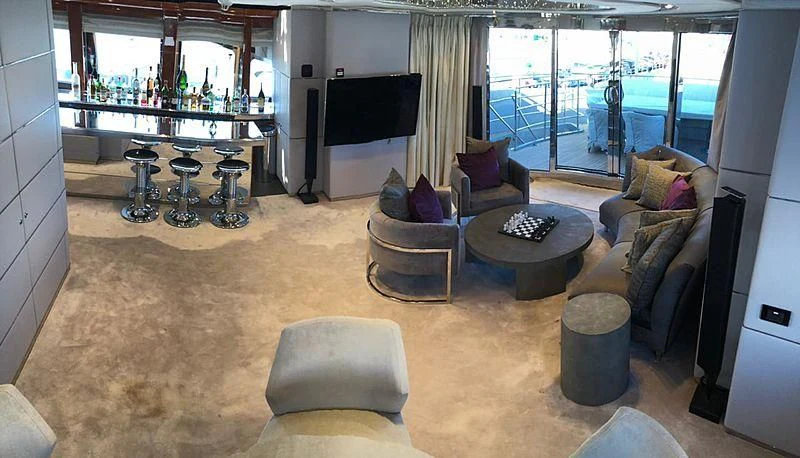 a living room with a large window aboard BLISS Yacht for Sale