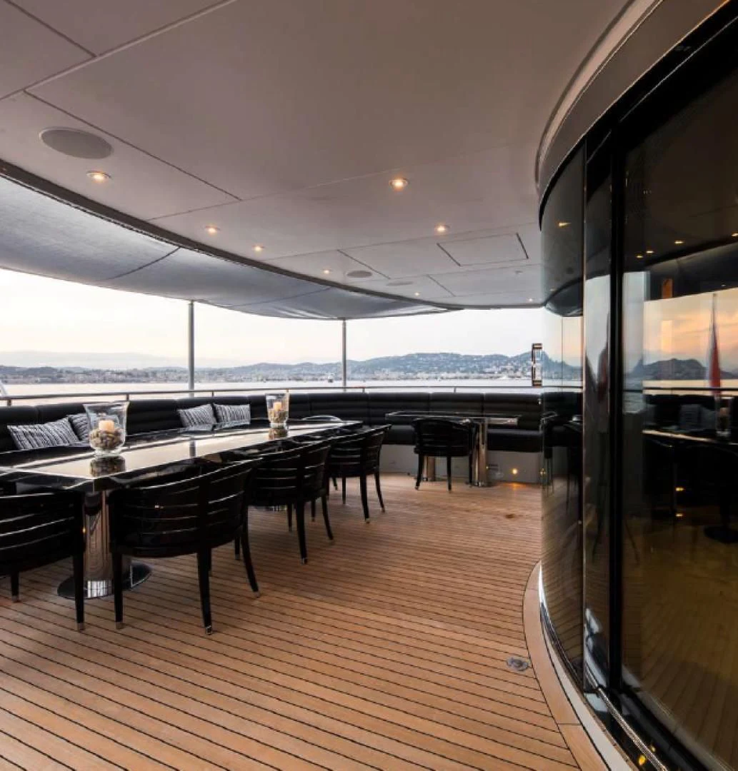 a room with a table and chairs aboard BLISS Yacht for Sale