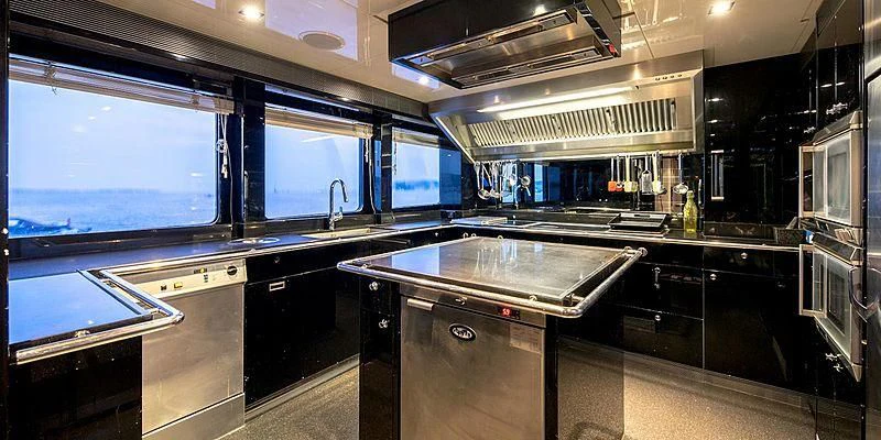 a kitchen with a stove and cabinets aboard BLISS Yacht for Sale