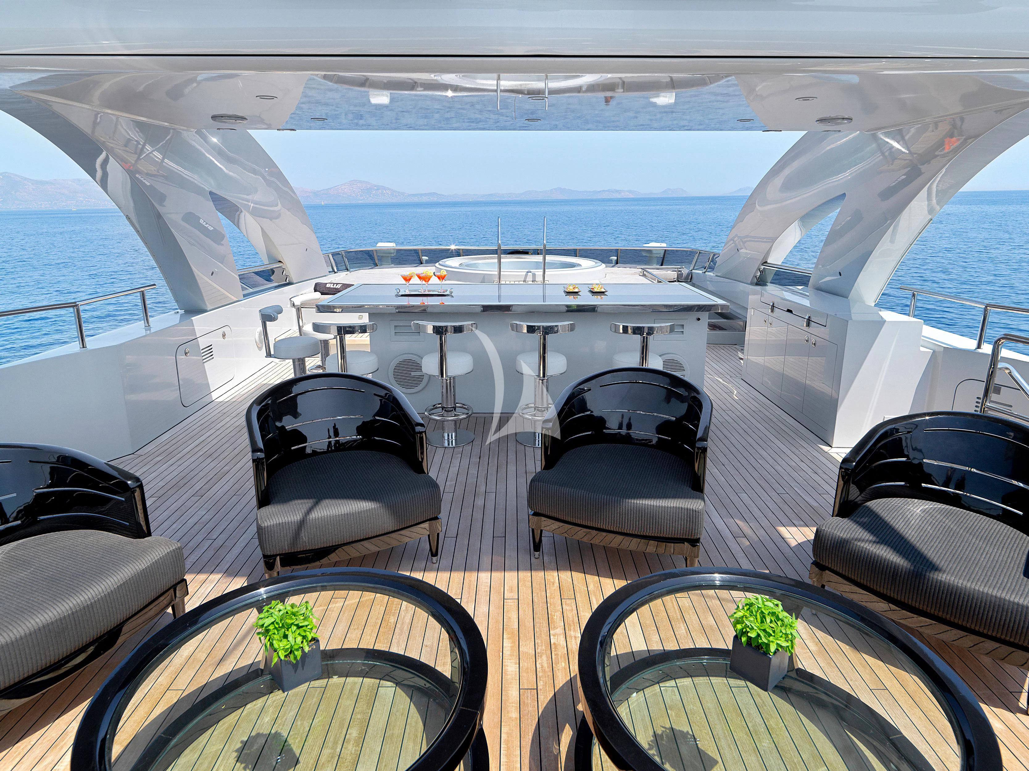 a room with a large window and a table with chairs aboard BLISS Yacht for Sale