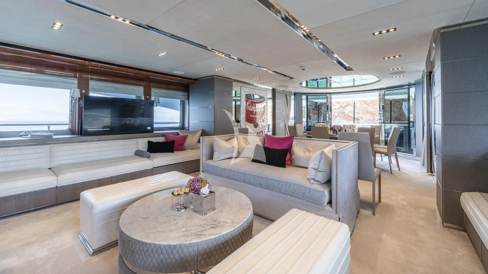 a living room with a couch and a table aboard BLISS Yacht for Sale