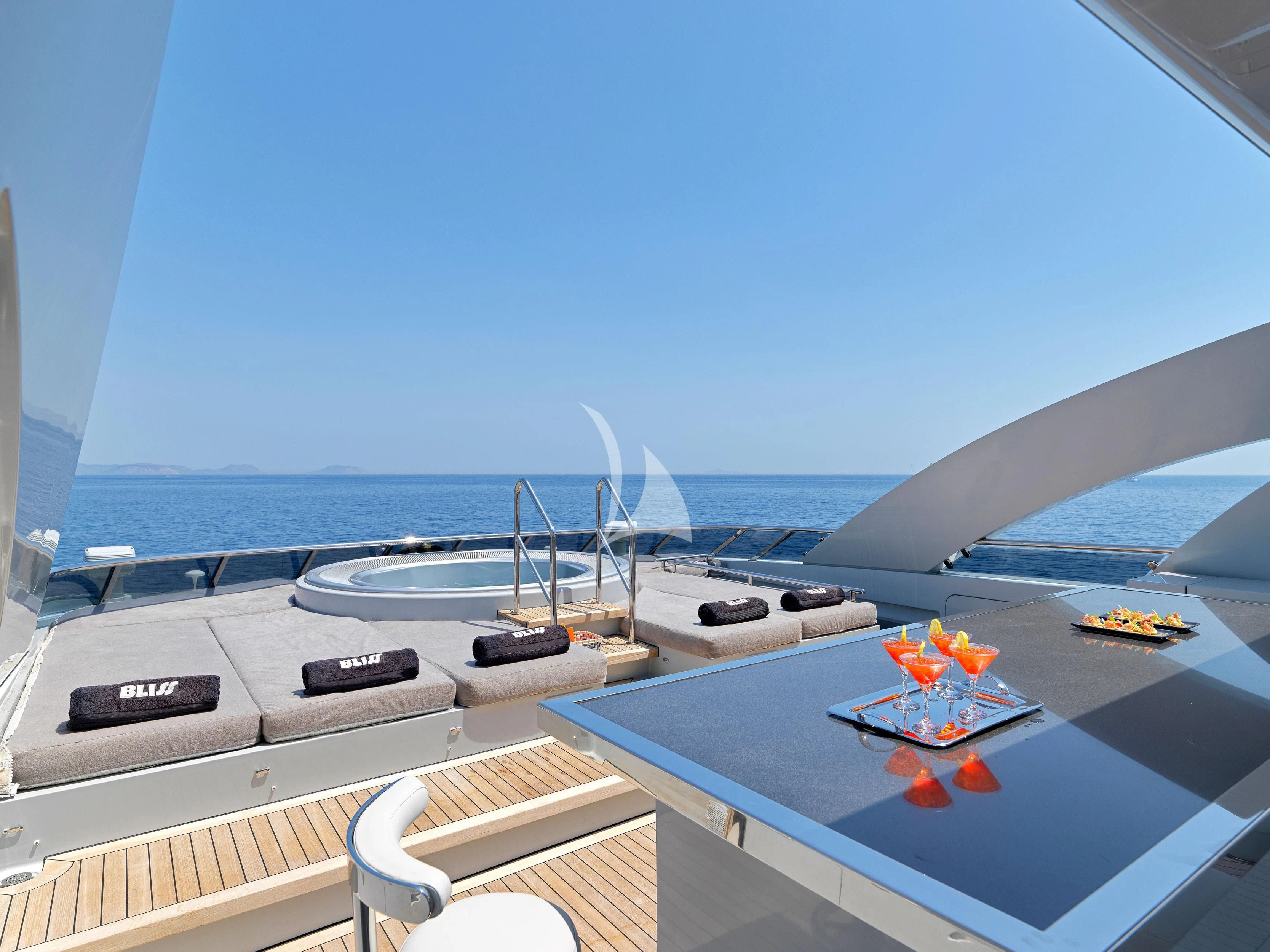 a pool with a deck and a view of the ocean aboard BLISS Yacht for Sale