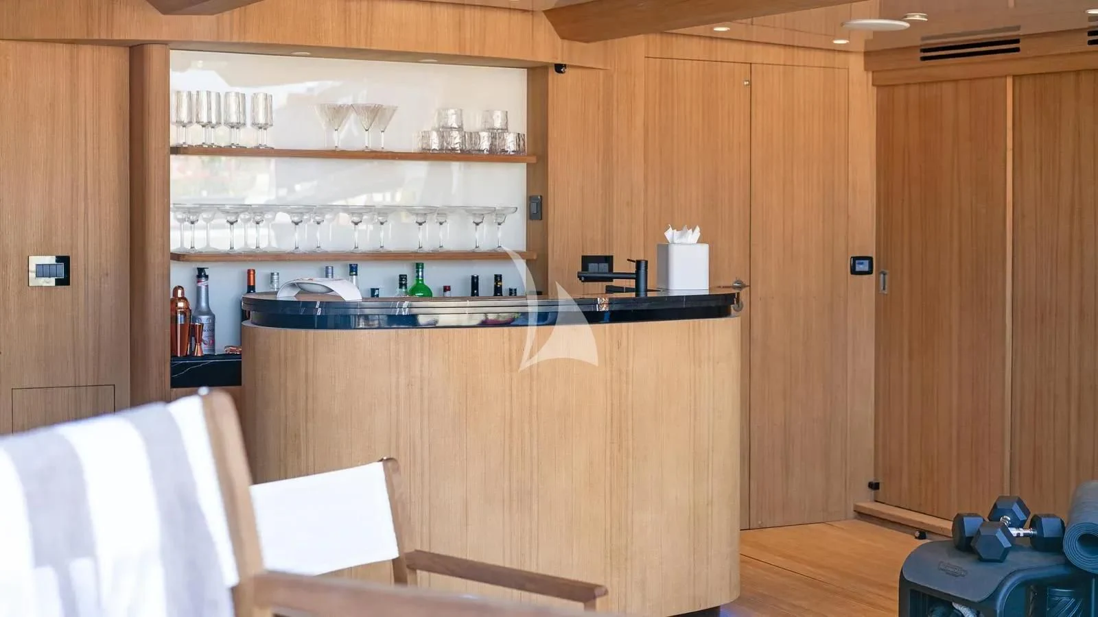 a kitchen with wooden cabinets aboard BLISS Yacht for Sale