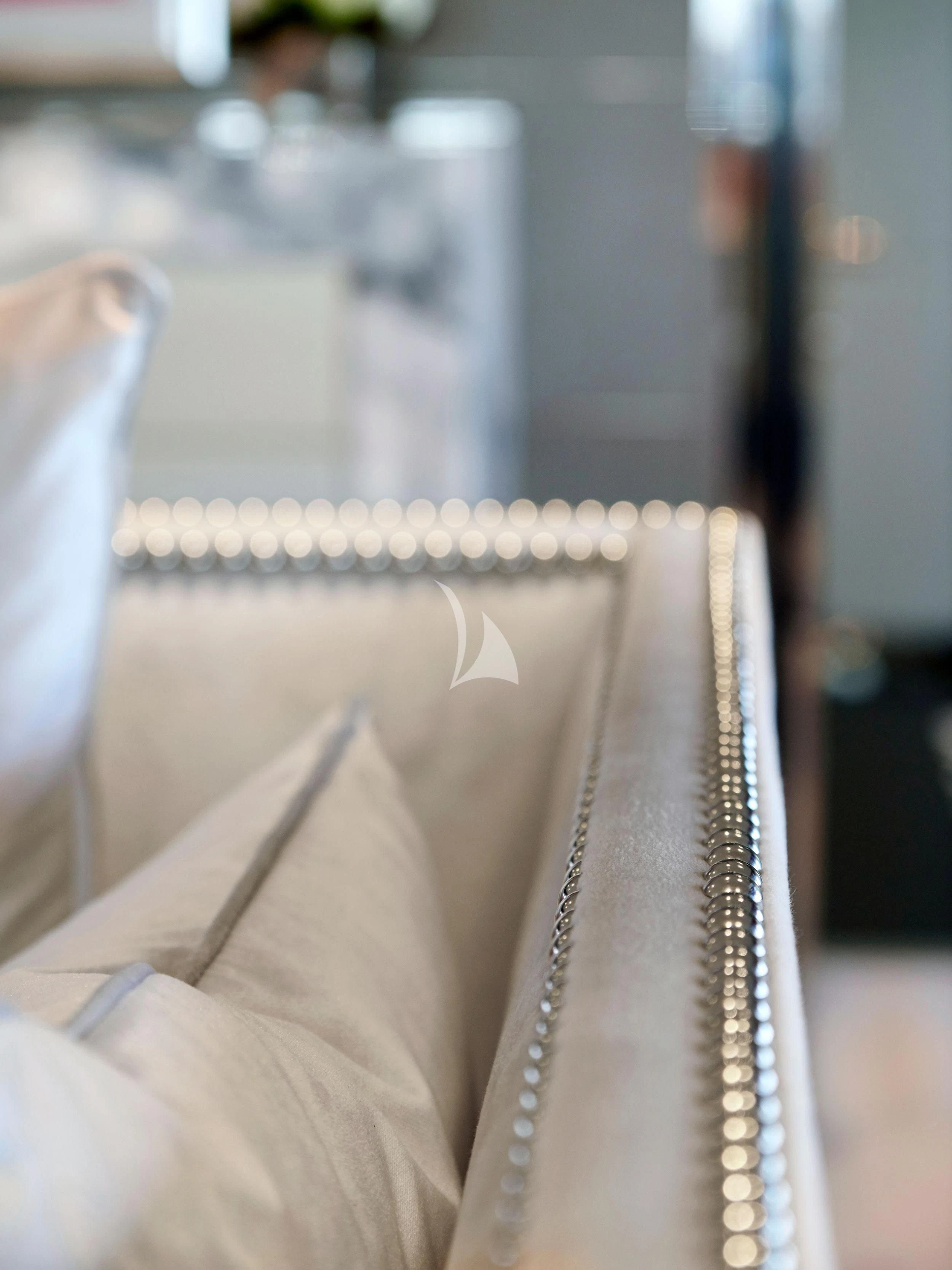 a close-up of a person's legs aboard BLISS Yacht for Sale