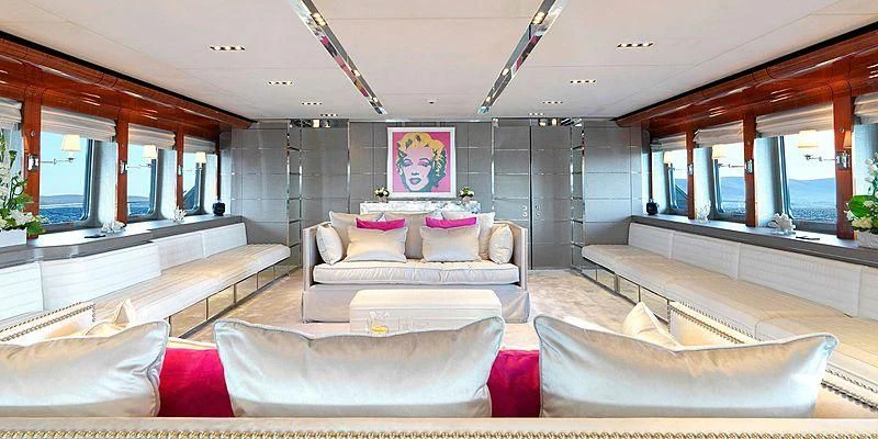 a room with a couch and a table aboard BLISS Yacht for Sale