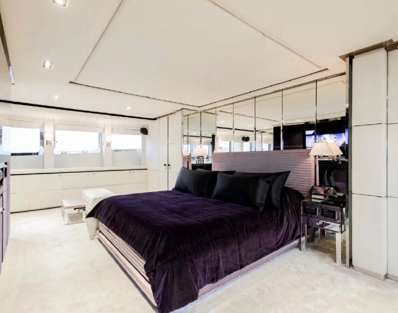 a bedroom with a large bed aboard BLISS Yacht for Sale